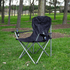 An oversized folding chair in black with cup holders, set on grass among trees. It features a simple design and a logo.