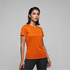 An orange women's active tee with a fitted style, featuring short sleeves and a logo.
