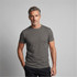 A grey men's t-shirt with a classic crew neck style, featuring a fitted silhouette. The model showcases the garment.