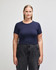 A navy blue crop fitted t-shirt on a model, paired with black high-waisted jeans. The shirt has a logo.
