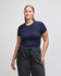 A fitted women's crop t-shirt in navy blue, paired with high-waisted black pants. It features a logo on the garment.
