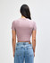 A women's crop fitted t-shirt in mauve, featuring short sleeves and a fitted design, with a logo on the back.