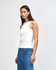 A fitted women's tank top in white, featuring a high neckline and a simple design.