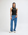 A fitted black tank top displayed on a model, paired with blue jeans and white shoes. The top features a logo.