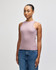 A fitted tank top in mauve, featuring a cut-out shoulder design, paired with blue jeans.
