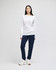 A white long-sleeve T-shirt worn with navy pants, featuring a logo on the shirt.
