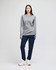 A long-sleeve grey T-shirt paired with navy pants, featuring a logo on the shirt.