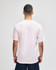 A plain pink Champion adult jersey short sleeve T-shirt viewed from the back, featuring a simple design.