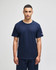A navy blue Champion Adult Jersey Short Sleeve T-Shirt, displayed on a model standing against a neutral background.