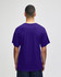 A purple Champion Adult Jersey Short Sleeve T-Shirt displayed from the back, featuring a simple design and no visible logos.