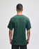A green Champion Adult Jersey Short Sleeve T-Shirt viewed from the back, featuring short sleeves and a simple design.