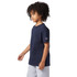 A navy short sleeve t-shirt featuring a logo on the sleeve, suitable for youth wear.