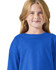 A blue long sleeve youth t-shirt displayed on a smiling child, featuring a simple crew neck design and one logo.