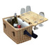 A wicker picnic basket with a wooden table attachment, two bottles, a can, and four glass tumblers.