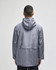 A man wearing a grey Champion Adult Full-Zip Anorak Jacket with a hood, viewed from the back.