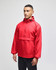 A red packable anorak jacket with a half-zip and hooded design, featuring a logo. Model wearing black pants.