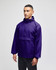 A purple packable anorak jacket with a hood and a front pocket, featuring a logo on the sleeve.