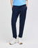 Navy fleece jogger pants with pockets, featuring a logo. Worn with white sneakers and a blue top.