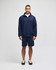 A navy quarter-zip pullover and matching shorts, featuring a logo, displayed on a model standing against a plain background.