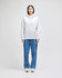 A grey full-zip hooded sweatshirt with a front pocket and a logo, paired with blue jeans.