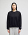 A black women's crewneck sweatshirt with a relaxed fit, featuring a small logo on the sleeve.