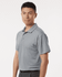 A men's polo shirt in grey featuring a collared neck and short sleeves, with a logo on the chest.