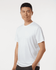 A white performance t-shirt is displayed on a male model with a smooth fabric and a simple design.
