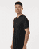 A black men's performance t-shirt displayed on a model, featuring a fitted design and a logo.