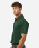 A green polo shirt is displayed on a model, featuring a collar, short sleeves, and a logo on the chest.