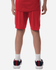 Red performance shorts worn by a person from the back, featuring a logo on the garment.