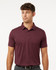 A men's polo in heather maroon with a classic collar and short sleeves. It features a logo on the chest.