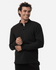 A man wearing a black stretch fleece 1/4 zip top with a smile, featuring a logo on the chest.