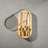 An oval bamboo knife set featuring a cheese knife, chef’s knife, and corkscrew, all with wooden handles.