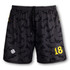 Sporty men's volleyball shorts featuring a black pattern with yellow accents and a logo on the front.