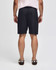 Black gym shorts with an elastic waistband, viewed from the back, featuring a simple design and branding.