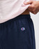 Navy gym shorts featuring an elastic waistband and a logo on the side. Ideal for athletic wear.