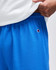 Bright blue cotton gym shorts with an elastic waistband and logo detail on the side.