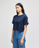 A navy cropped short sleeve t-shirt with a logo on the sleeve and relaxed fit. Suitable for casual wear.