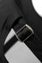 A close-up of a black cap featuring a metal buckle and strap detail.