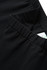 Black girl's cotton spandex shorts featuring an elastic waistband and a small tag.