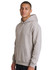 A light grey hoodie with a kangaroo pocket and hood, worn by a man standing sideways. Features a logo on the chest.