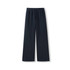Unisex wide-leg fleece pants in navy, featuring an elastic waistband and drawstring. Includes a logo.
