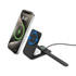 A magnetic wireless charger in black, with a smartphone and earphones docked, featuring a brand logo.