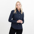 A woman models a navy blue Women's Allen Oxford Shirt with a button-up design and long sleeves.