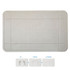 A grey bath mat with a textured surface, featuring a logo. It has bordered sections and shows footprints.