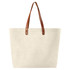 A beige cotton tote bag with brown leather handles and metal studs, featuring a simple design.