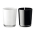 A glass candle set featuring one white and one black candle, each with a wick, in sleek glass containers.