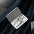 A manicure set with silver metal tools, housed in a sleek white case.