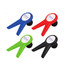 A set of four wine stoppers in blue, red, green, and black, each featuring a logo.