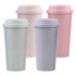 A set of four reusable bamboo coffee cups in soft pink, light purple, mint green, and pale beige, each with a matching lid.